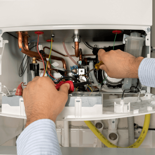gas system plumbing optimised Local Plumber performing maintenance on a hot water system