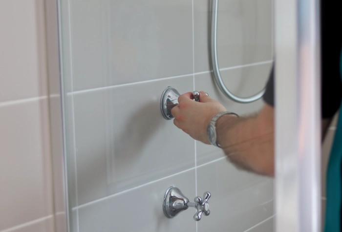 Professional plumber completing a leak inspection