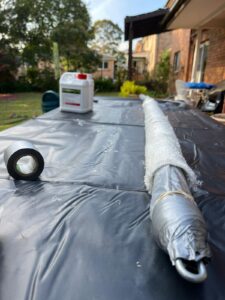 plumbers with cameras inspecting a pipe for relining in sydney