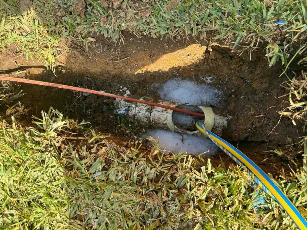 Trenchless-Pipe-Relining-Sydney-The-Clean-Plumber-7 Plumbers with cameras inspecting a blocked drain